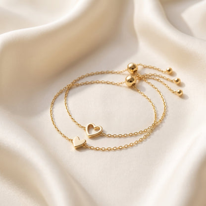Matching Hearts armbanden set in goud — open en dicht hartje