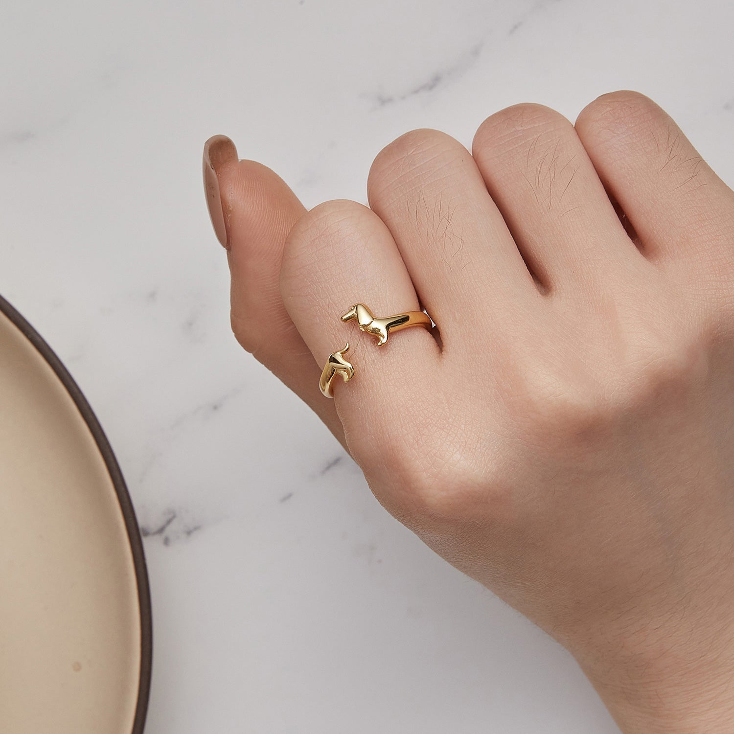 Teckel Wrap Ring gold worn on hand